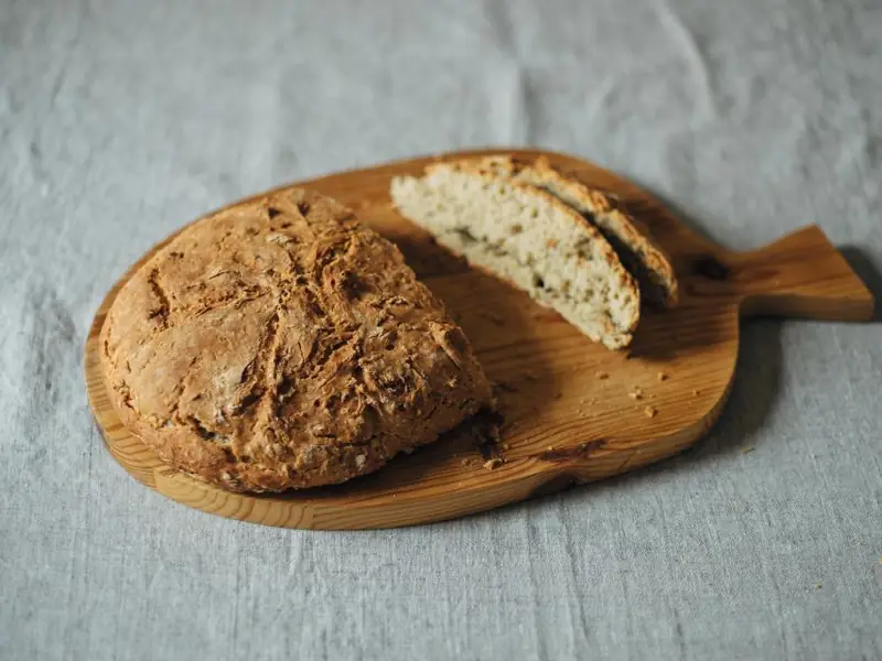 Loaf of sourdough bread on a wooden board