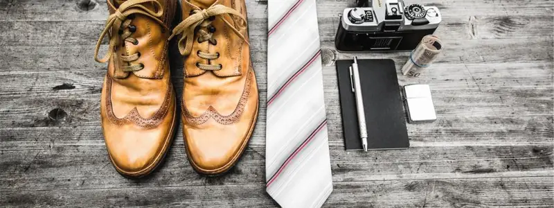 Pair of brown leather brogues on wooden boards
